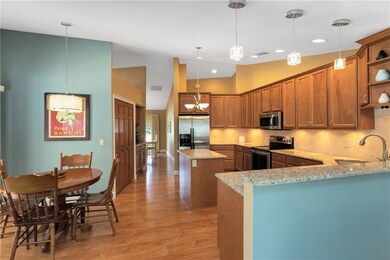 Open kitchen with plenty of cabinet space plus a pantry & extra desk/storage area down the hallway.