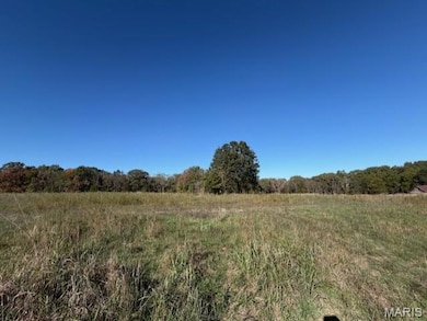View of woods with a view of rural / pastoral area