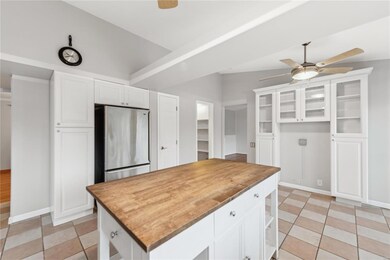 Bright & cheery white kitchen with center island, 