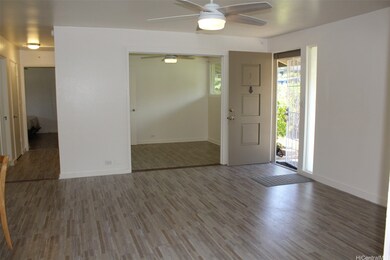 third bedroom with sliding doors by front door