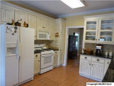 The large Kitchen features granite countertops, 2 pantrys and a gas stove.