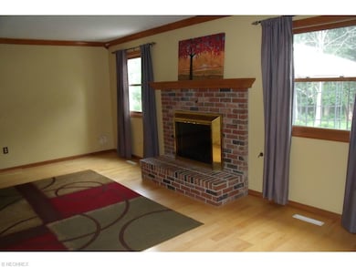Family room with fireplace and laminate floors