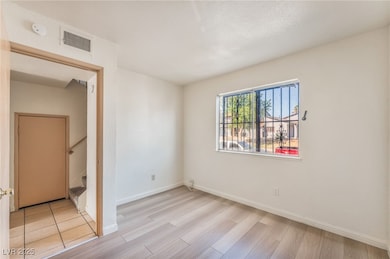 Unfurnished bedroom featuring baseboards and light wood-style flooring