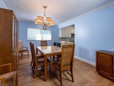 Dining room featuring baseboards, light wood-style