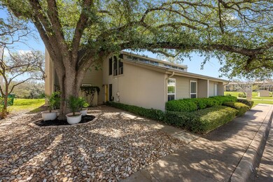 View of side of home with stucco siding