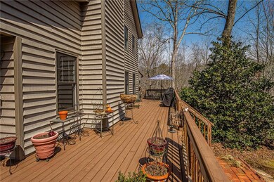 Wooden terrace featuring ceiling fan