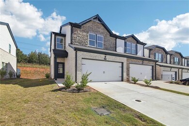 Townhome / multi-family property with a garage and
