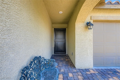 Entrance to property featuring stucco siding