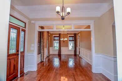 Foyer and views of formal dining