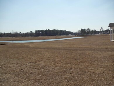 View of yard with a water view