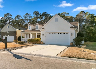 View of front property featuring covered porch and