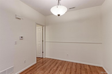 Dining room with powder room around corner