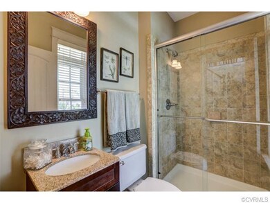 First floor full bathroom with tiled floor and sho