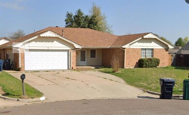 Ranch-style house with a garage, brick siding, a s