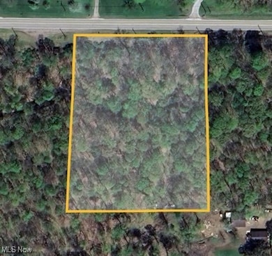 Aerial map of property and surrounding area with property parcel outlined