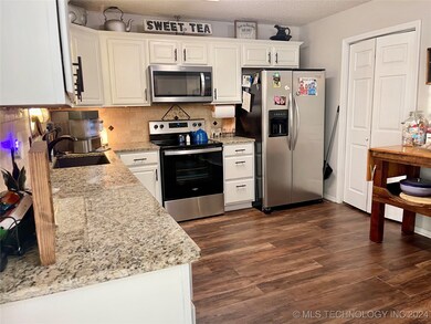Large open kitchen with granite countertops & stai