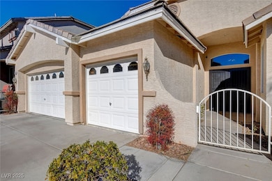 View of side of home with stucco siding, driveway,