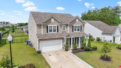 View of front of home with concrete driveway, a shingled roof, a garage, central AC, and covered porch