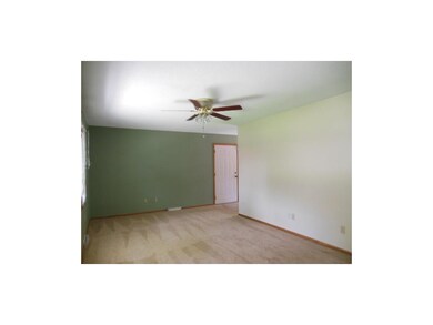 Living room with ceiling fan.