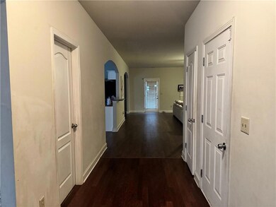 Corridor featuring dark hardwood / wood-style floors