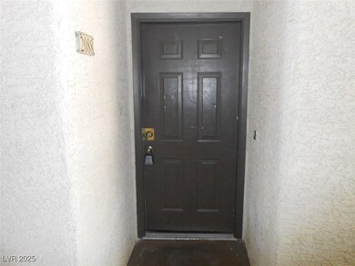 Property entrance featuring stucco siding