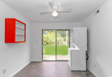 Interior space with ceiling fan, stacked washer / 