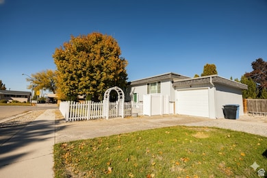 View of front of property with a fenced front yard and driveway