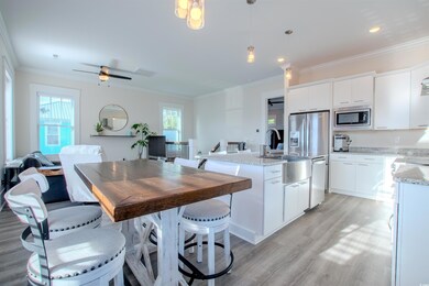 Kitchen with white cabinetry, stainless steel micr