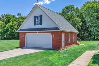 Detached garage matches the home in every way for cohesive look.