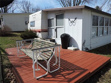Stained wood deck in backyard.