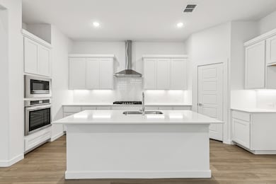 Kitchen in the Picasso II home plan by Trophy Signature Homes – REPRESENTATIVE PHOTO