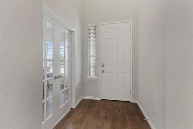 Front entry way. French doors on the left lead to 
