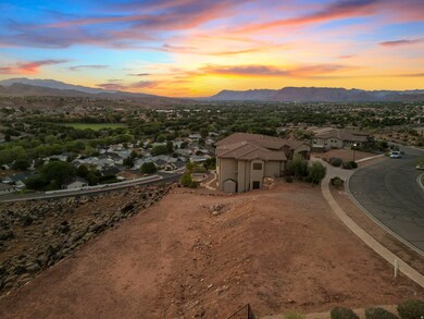 View of mountain backdrop featuring nearby suburban area