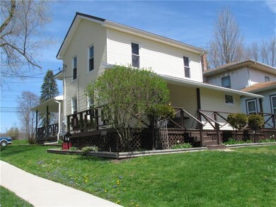 REAR OF HOME HAS A COVERED DECK/PORCH
