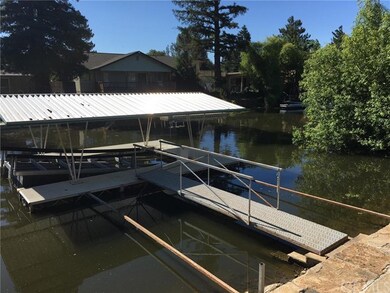 Covered boat dock with ramp and lift
