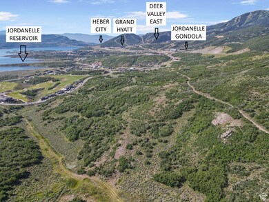 Aerial view of property's location with a water and mountain view