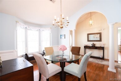 Dining room featuring natural light, hardwood floo