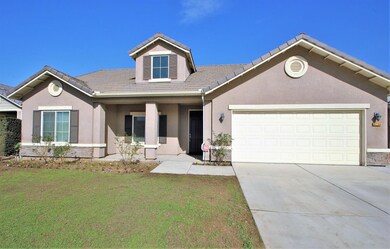 Front View, newly seeded lawn area, tile roof, stu