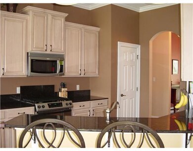 Kitchen. Beautiful maple cabinets with chocolate g