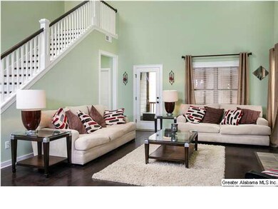 Great Room features 20+ ft ceilings & gas log fire