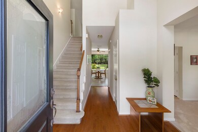 As you enter, you are welcomed by warm wood floors