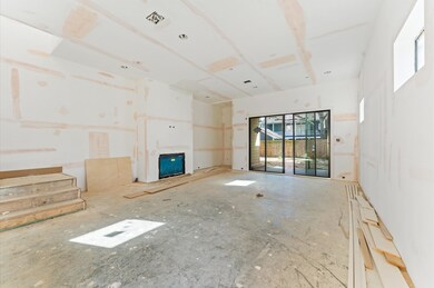Expansive living room with modern gas fireplace an