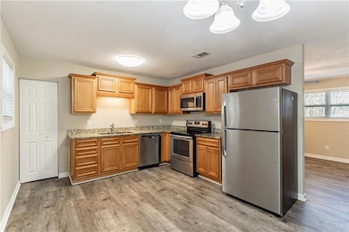 Kitchen featuring appliances with stainless steel 