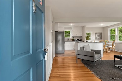 Foyer entrance featuring light wood-style floors a