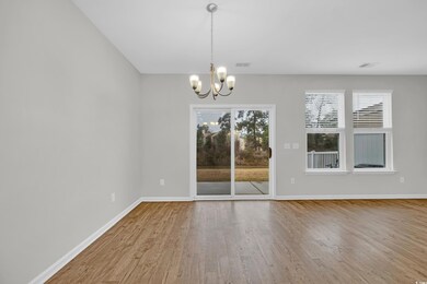 Unfurnished dining area with an inviting chandelie