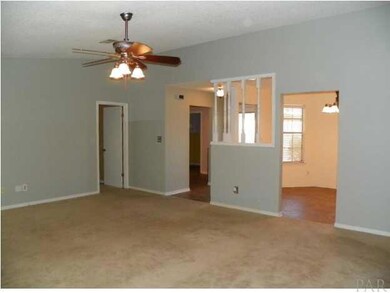 Great room with view of dining room, foyer and entrance to master bedroom