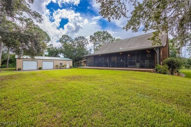 View of backyard featuring screened lanai, deck, a