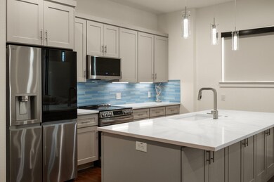 Kitchen featuring stainless steel appliances, a s