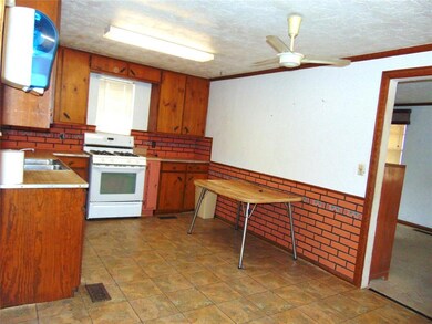 Kitchen with sink, ornamental molding, white range