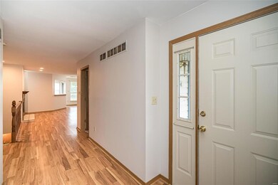 Large entry foyer with laminate flooring.